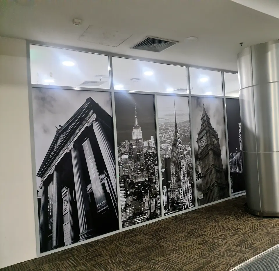 Glass office front with printed city graphics